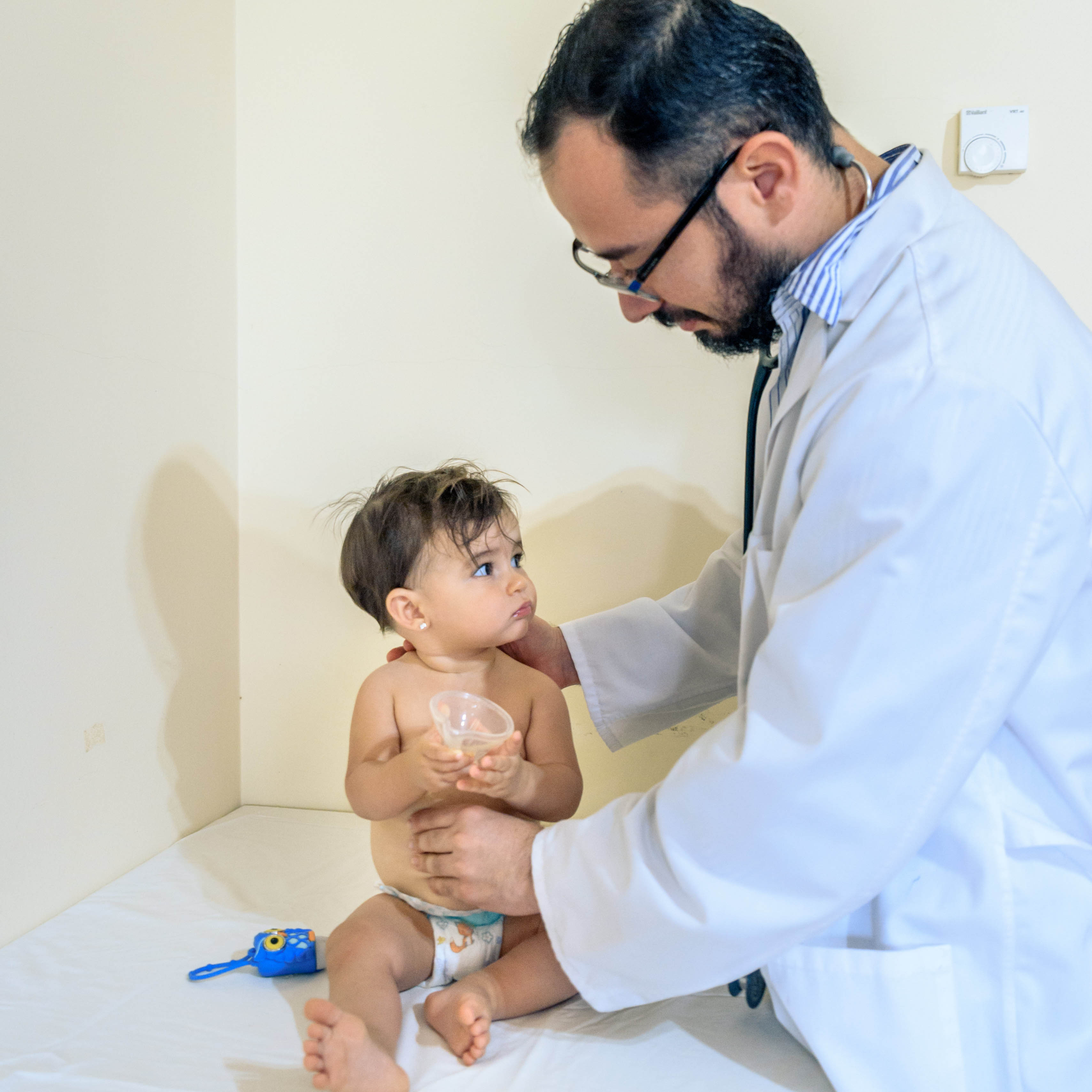doctor-observing-one-year-old-baby-suffering-diarrhoea